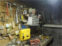 Various tools on wall and top of bench  BASEMENT