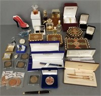 Group including medallions, pens, perfumes, etc. *