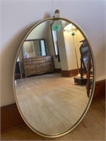Oval gold coloured framed mirror-18x26”
