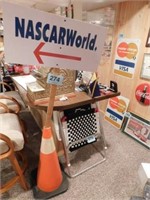 Nascar World direction sign on orange safety cone