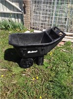 Garden cart behind garden shed