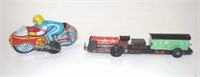 Two Japanese wind up tin toys