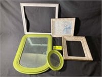 GROUP OF PICTURE FRAMES AND A MIRROR