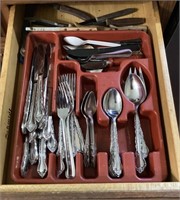 Group of flatware in kitchen drawer