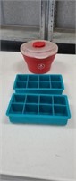 Two silicone ice cube trays and covered Bowl