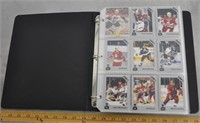 Mixed hockey & baseball cards in binder