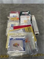 Assortment of cross stitch supplies, mostly