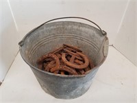 B10- BUCKET OF HORSE SHOES