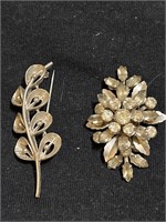 2 vintage silver tone brooches, one has