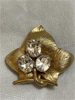 Vintage gold tone leaf brooch with rhinestones