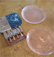Cheese board with tools and 2 pink platters