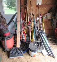 Vary large lot of yard tools includes shovels,
