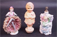 A figural baby perfume bottle, a Dresden-style