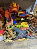 dinosaurs and plastic kids cars