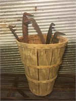 Basket with scythe blades.