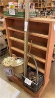 Shelf with survey stick, plastic crate with wire,