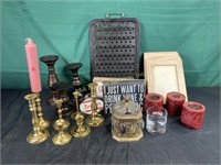 Candles, brass candlesticks, glass and metal jar,