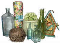 Birdhouse and Glass Bottles