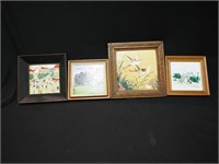 Four framed tiles; three depicting buildings and