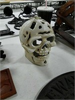 Cast skull candle holder.