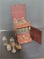 Antique mahogany case with six glass jars