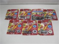 NIP 7 Johnny Lightning Cars W/ Collectors Coins