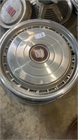 5 miscellaneous Cadillac hubcaps