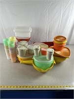 Tupperware mixing bowls, cake pan, strainers,