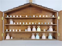Wood display cabinet w/bisque thimbles & bells,