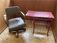 Office chair and old metal table with casters and