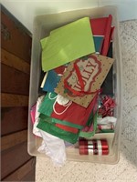 tissue paper with holiday gift bags, and ribbon
