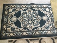 Rug 46” x 29.5” and carpet remnant