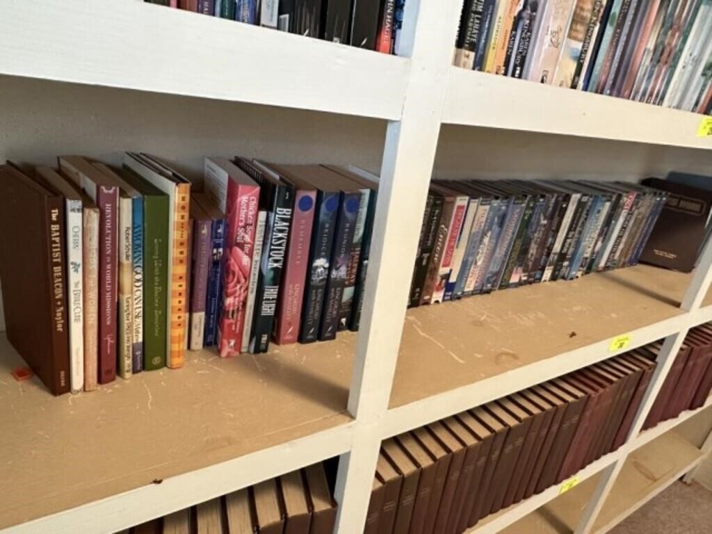 All books and VHS tapes on 4th shelf