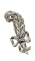 Sterling silver feather and bow brooch,