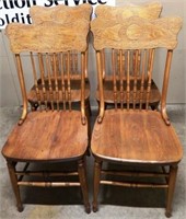 Four Vintage Pressed-Back Wooden Chairs