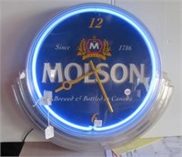 Molson neon beer light/clock. Measures 20"