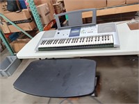 Yamaha Keyboard with Stand.
Keyboard
