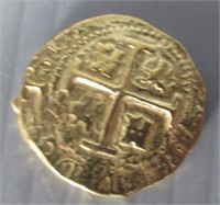 Gold layered on fine metal shipwreck coin.