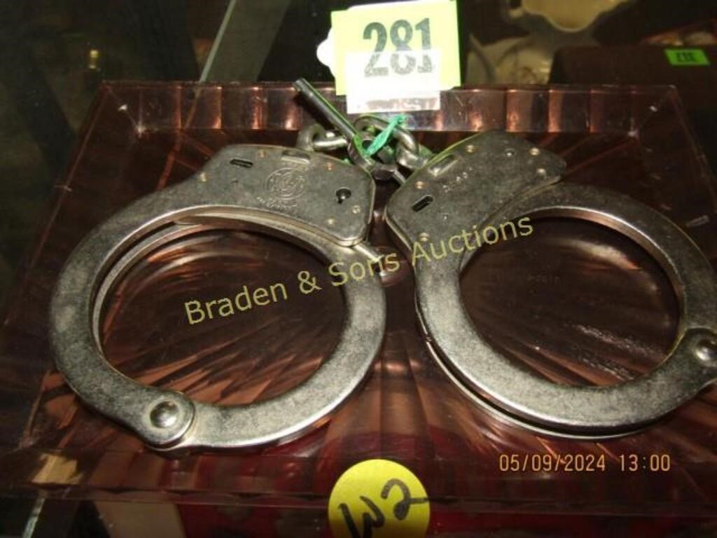 PAIR OF USED SMITH AND WESSON HAND CUFFS WITH