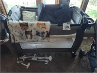 Baby Trend portable crib w/ accessories