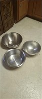 Three large stainless steel mixing bowls