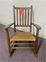 Antique rocking chair with wicker bottom