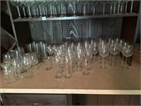 Large group of wine glasses and serving glasses