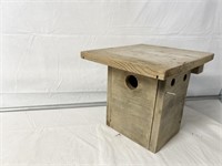 Wooden bird house with pole