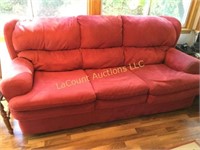 red sofa 87" long needs a cleaning on one end