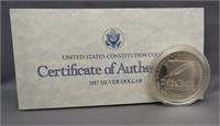 1987 US Constitution proof silver dollar.