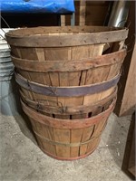 Several wooden apple baskets and metal tub with