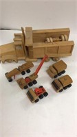 Wooden dump truck and 5 smaller wooden trucks