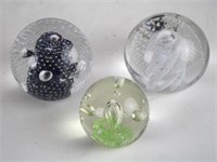 THREE GLASS PAPERWEIGHTS