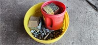 Small pail of cultivator shovel bolts